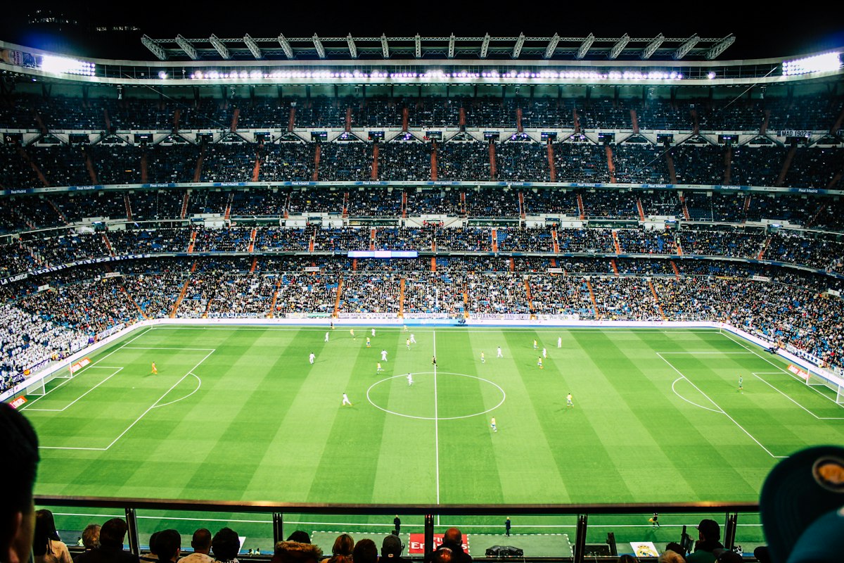 Midnight Football Arena Under Stadium Floodlights